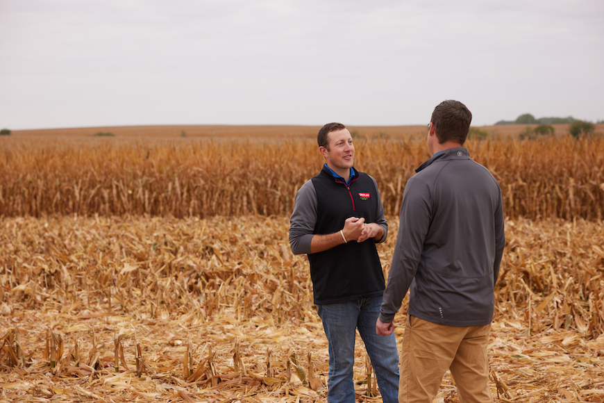 CROPLAN retailer discussing hybrid decisions with a grower
