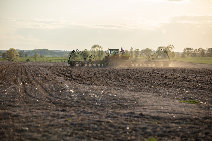 Planter driving through the field