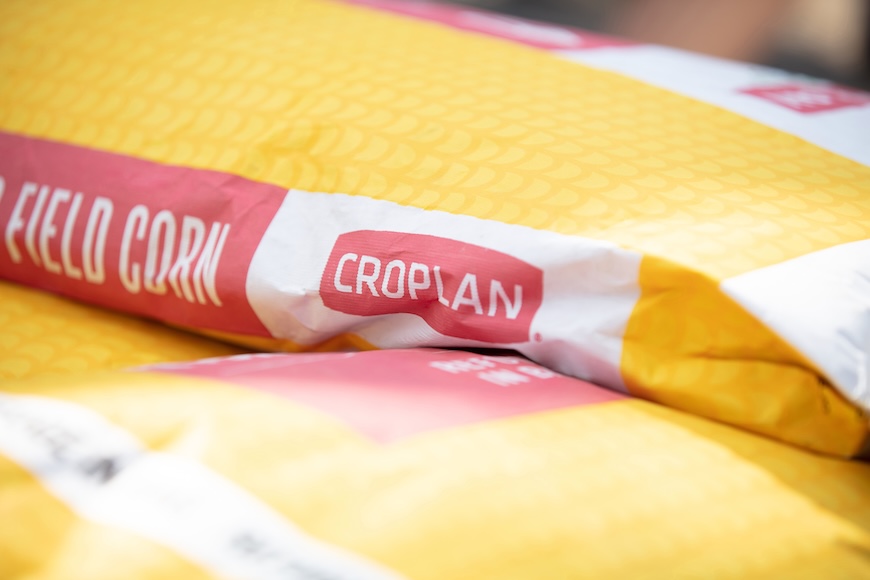 A yellow and red bag of CROPLAN field corn 